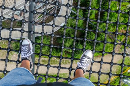 person standing on a metal safety net; Annuities for the Unexpected in Retirement