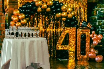a 40th birthday party in gold and black; Financial Founder Should Make Before 40