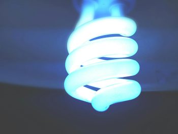 big white twirly bulb on dark background; Why Your Power Bill Is So High