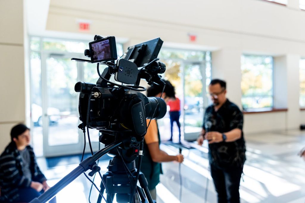 camera team setting up equipment; Media-for-Equity Can Supercharge Tech