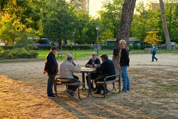group of older friends meeting in the park; Naturally Occurring Retirement Communities