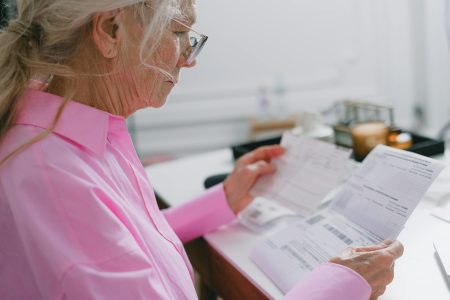 older woman in a pink shirt; How 2026 Tax Changes Could Impact Your Retirement Savings