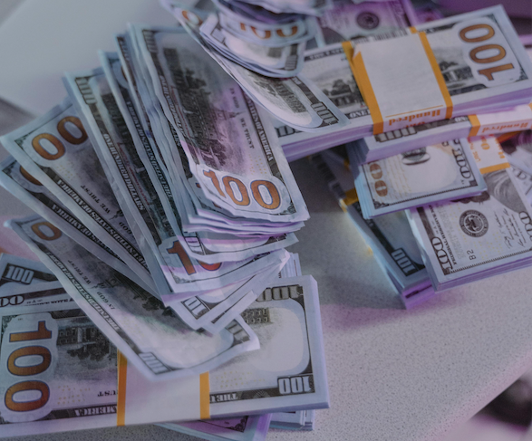 a stack of cash; How I Made $200,000 Posting on Facebook