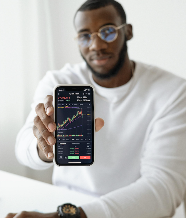 man showing phone with graph irregular income and still climbing; Irregular Income, Real Life: A Financial Playbook for Entrepreneurs