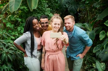 group of GenZ comparing notes; Lower-Income Gen Z is the Most Investment-Savvy Generation in History