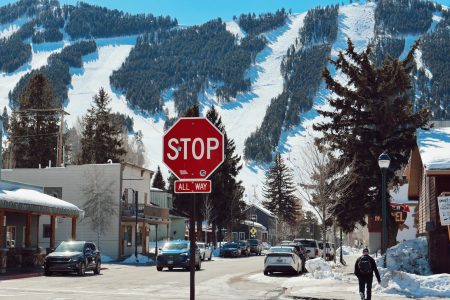 stop sign with western mountain range in the background; The Surprising New #1 State for Retirees in 2026