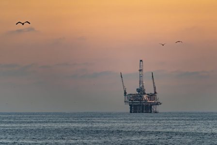 offshore oil rig at sunset; How to Protect Your Wealth and Wallet from Rising Oil Prices