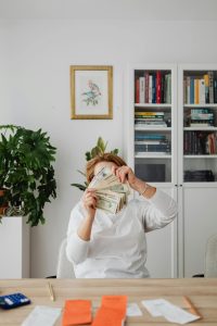 woman looking at her tax back; One Freelancer Cut Her Tax Rate