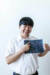 man showing how much he's earned in the index funds; $500K Portfolio Using Index Funds Automatic Transfers