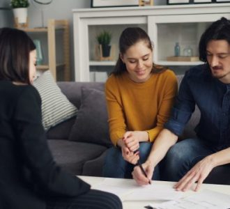 couple signing up for rental insurance; Best Companies for Renters Insurance in 2026