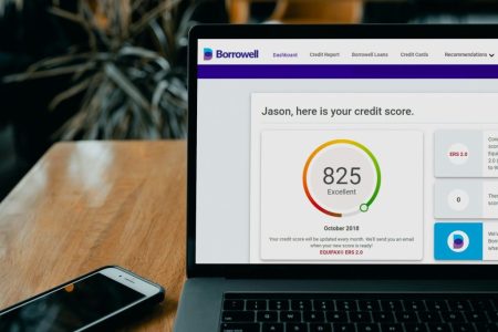 showing a credit score on a screen; Credit Score Trick That Boosted My Rating 97 Points