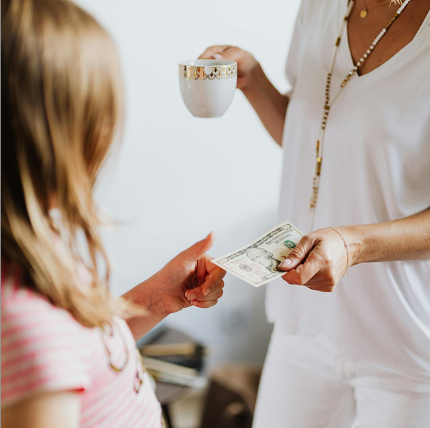 mom telling a daughter some money advice; Money Beliefs Your Parents Taught You That No Longer Apply