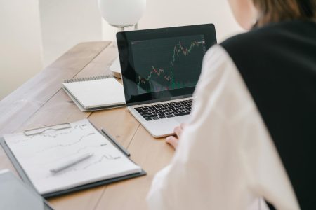 working at a desk on portfolio; The Q2 Pivot: A Technical Guide to Rebalancing Your Portfolio