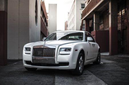 beautiful new white car; Car Loan Trick Dealers Use and How to Beat Them