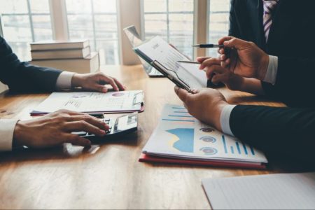finance working together at table; Cloud Computing Is Reshaping Financial Services