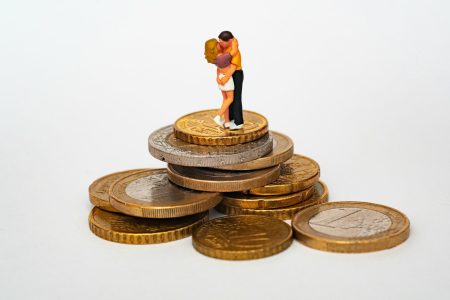 getting married standing on stack of coins; Financial Mistake 80% of Couples Make Before Getting Married