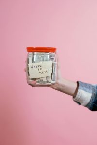jar on pink background where to move next; High-Yield Savings Accounts Are About to Get Less Attractive