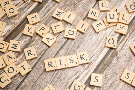 risks written in tiles; How Annuities Protect You From Sequence-of-Returns Risk
