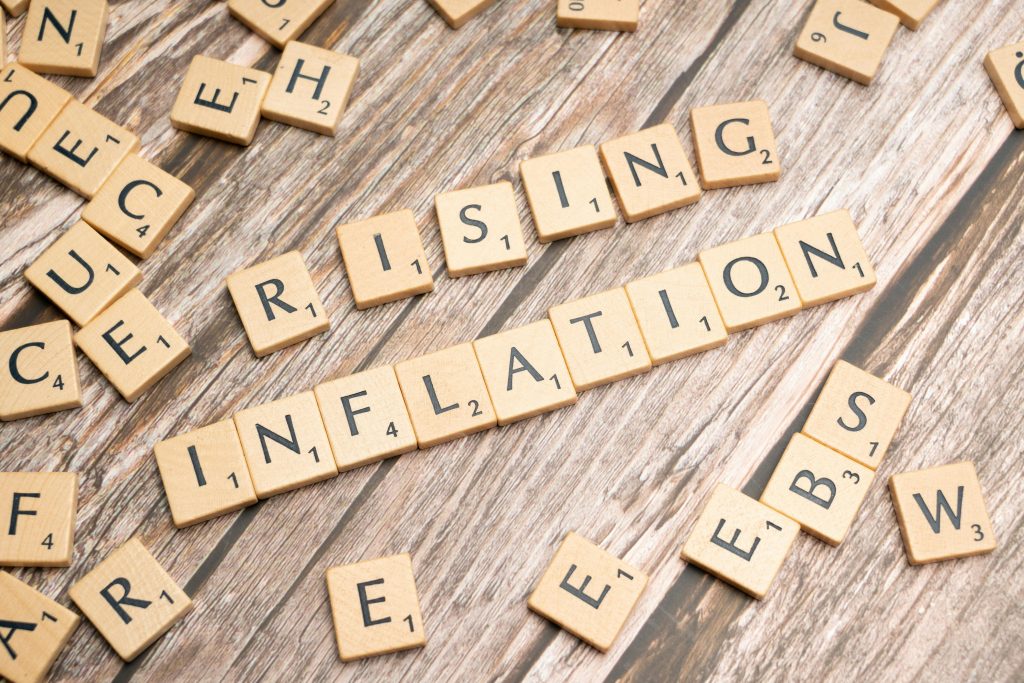 rising inflation in tile letters; Inflation Flashing A Warning Again