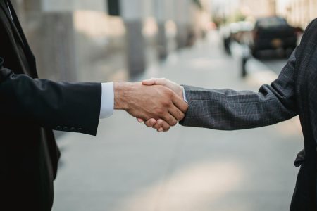 shaking hands on a boomer deal; Why Buying a Boomer Business Is the Ultimate Entrepreneurial Shortcut