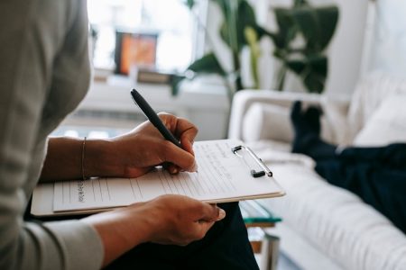 Person with notebook and calculator starting fresh financial planning