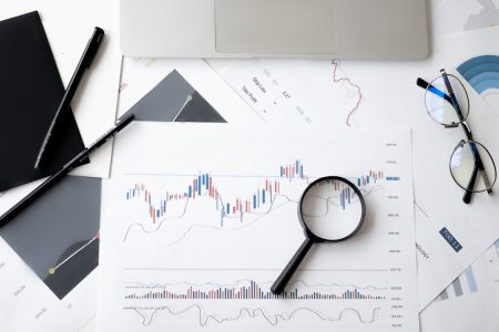 Financial charts and graphs showing investment growth impact of fees