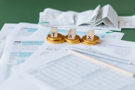 Tax documents and calendar representing year-end tax planning deadline
