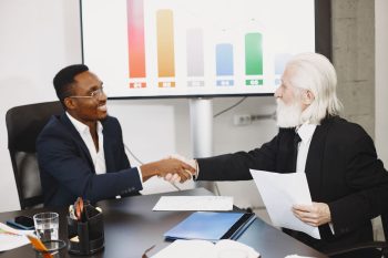 young entrepreneur buying from older entrepreneur; Acquisition Entrepreneur Playbook Buying from Retiring Generation