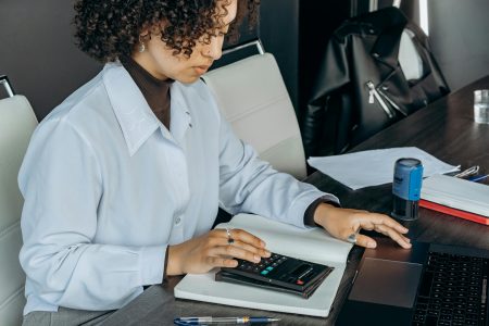 entrepreneur working on their finances; Blueprint for Automated Business Finance