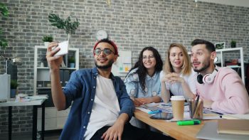 group of gen z working on a new business; Gen Z Should Trade the 9-to-5 for Entrepreneurship
