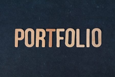 portfolio in large gold lettering on a black background; Scale Your Portfolio in the Age of AI
