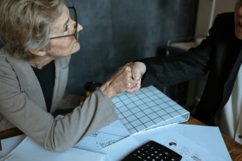 woman speaking of selling her business for retirement; Selling Your Business Might Not Fund the Retirement