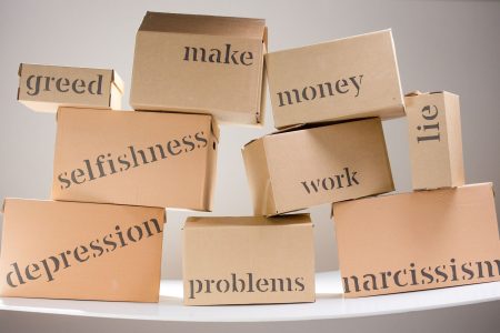 stacked brown boxes listing possible psychological areas; Why Smart Entrepreneurs Make Devastating Financial Choices