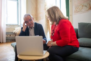 business couple working on their retirement; Why Your Business Is Not Your Retirement Plan