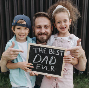 a dad with his kids "the best dad ever"; 65 Trap Waiting for Traditional Retirement Is a Huge Gamble