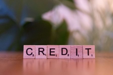credit written in block letters; Credit Score Do You Need to Buy a House
