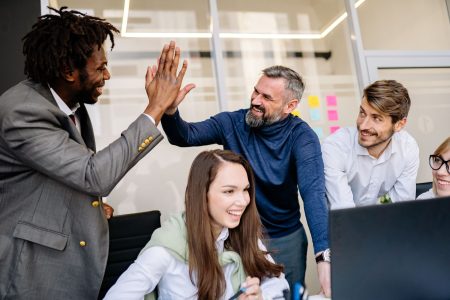 team in a happy office culture; Support Your Team When You Can't Give 10% Raises