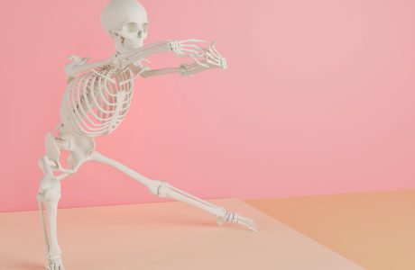 skeleton doing ballet on pink background; Build a Bare-Bones Budget for Tight Months