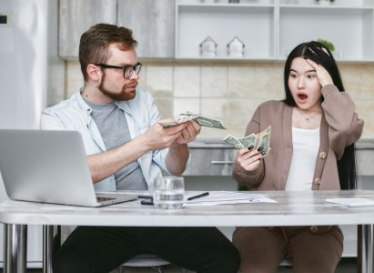 couple fighting over money; Couples Can Manage Money Without Fighting