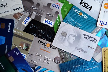 a table covered with all kinds of different credit cards;