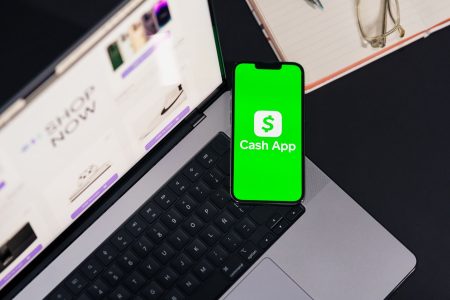 fintech apps on a computer and on a phone; Fintech Apps Actually Worth Your Money