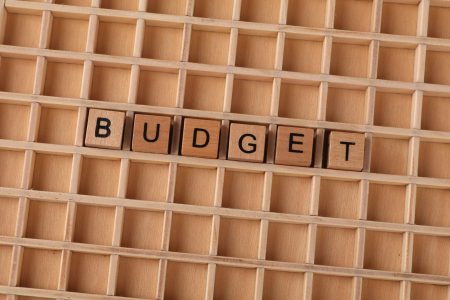 budget written in block letters on a wooden board; Create a Simple Business Budget