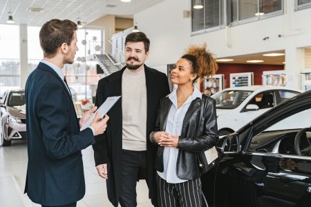 couple purchasing a new car; Leasing vs Buying a Car Which Makes More Sense