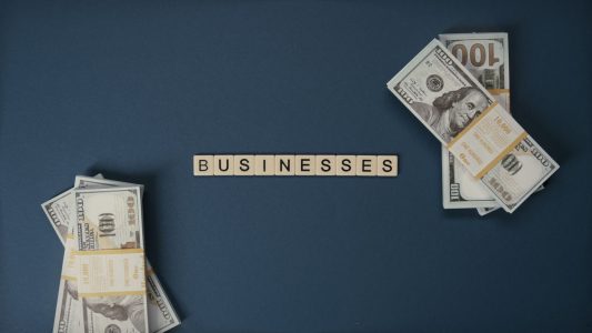 graphic showing businesses in block letters with money sitting on the side