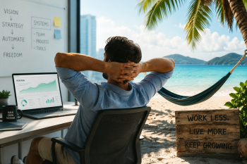 man sitting on a beach working during a mini retirement; Taking Advantage of Micro-Retirements (Without Losing Revenue)