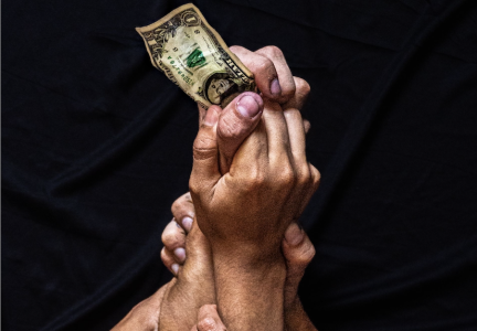showing hands grabbing and a fight over money; Talk to Your Partner About Money Without Fighting