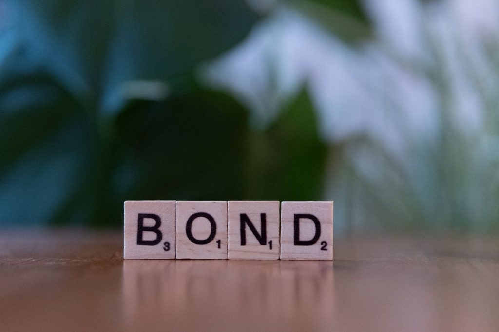 bond in block letters on a table top with green background; Bond, and Should You Own Them?