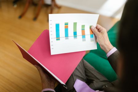 person looking at their portfolio and where to move accounts; How to Rebalance Your Portfolio (and How Often)