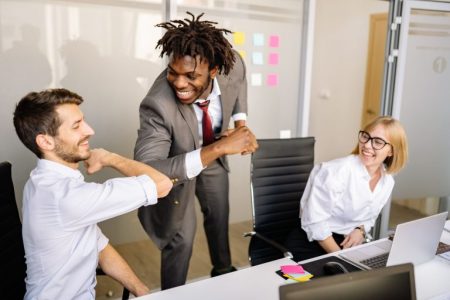 employees meeting together in conference room; How to Retain Your Best Employees Can't Offer Raise