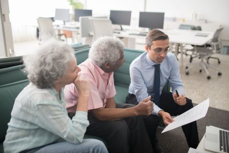 couple being sold an Indexed Universal Life policy;
